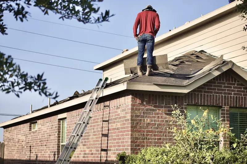 Professional roofer working on a residential roof in North Atlanta